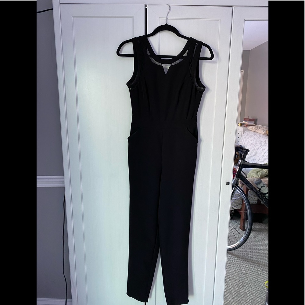 Black form fitting jump suit